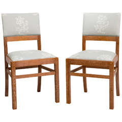 A pair of Limed Oak chairs by Heals and Sons, London.