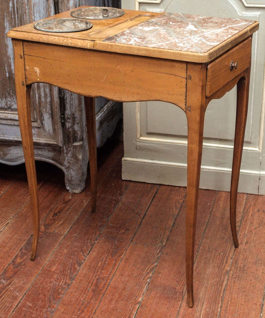 19th century walnut refraishisoir with two zinc buckets for wine and marble for the cheese and with a small drawer. It has lovely graceful legs.