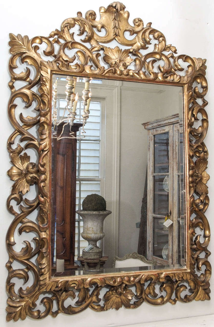 19th century carved gilded wood mirror in the acanthus leaf design.