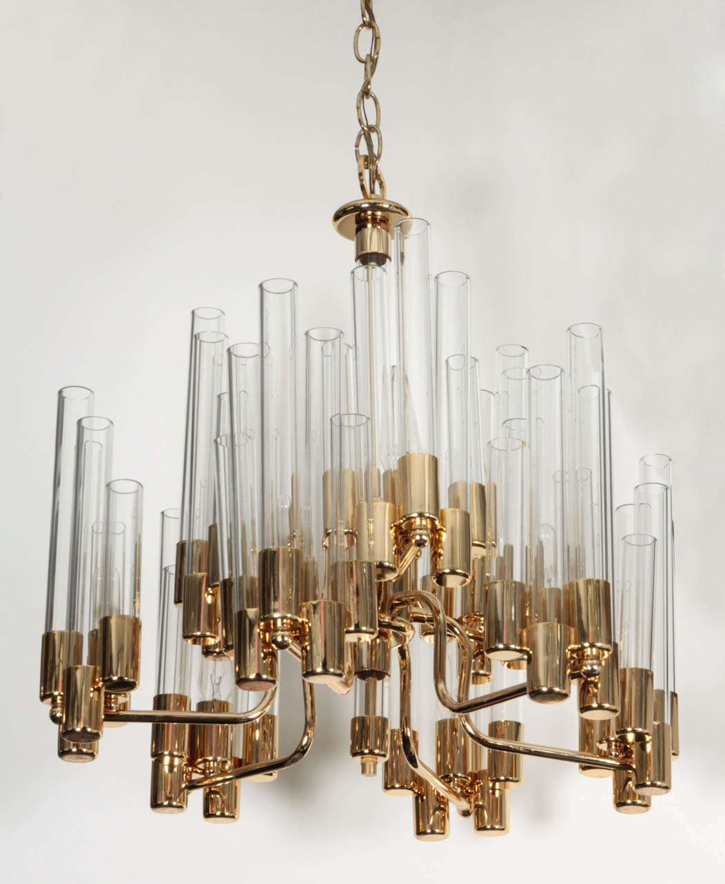 Fantastic Mid Century 2 tier brass and clear glass chandelier designed by Hans Agne Jakobsson. Bottom tier has 6 arms, top tier has 3.  Comes with 4ft of brass chain. Price reduced from 4800.
