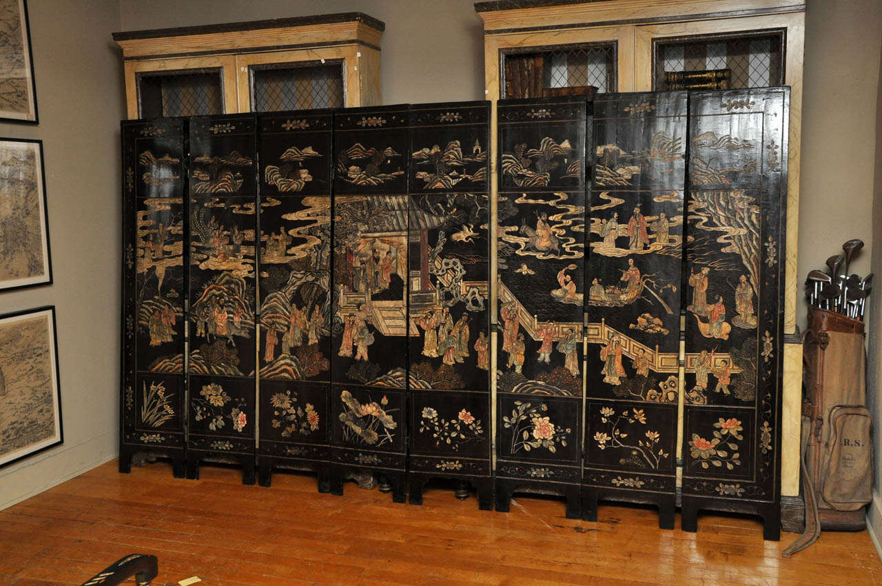 Chinese Coromandel Double Sided Ebonized screen with incised lacquer decoration on both sides
one side has naturalistic design of flora and fauna, the other has
a palace landscape with human figures, pagodas, and ponds.