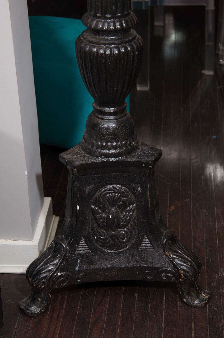 antique cast iron candlesticks