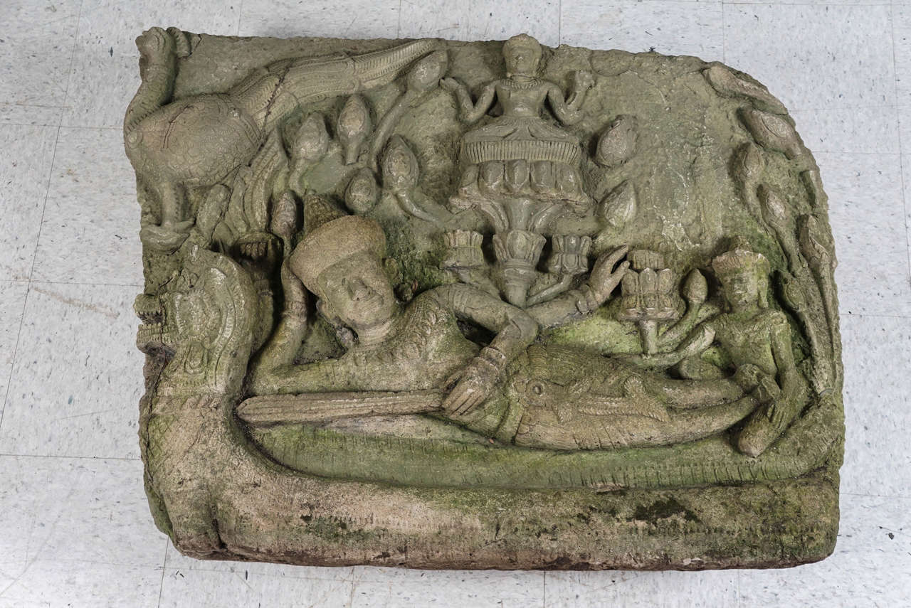 This temple relief was purchased from a late 19th century upstate NY garden. This lovely Buddhist carving is in an as found state taken directly from the garden where it sat for the last century The family legend is that this was bought in Siam at