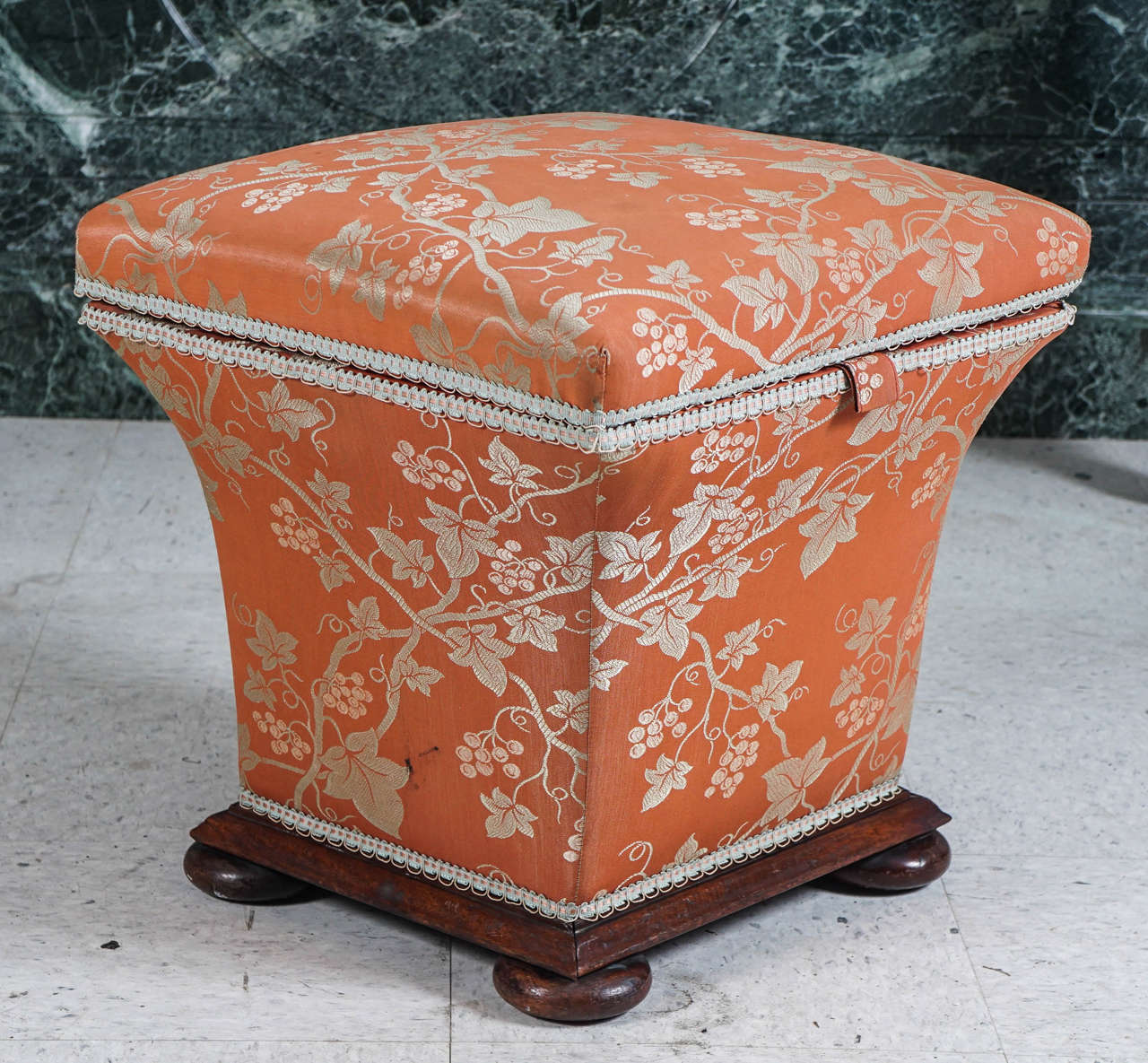 This lovely small storage ottoman was made in England during the mid-1860s The form a common design has been made from the regency period into the mid 19th century and into the early Edwardian period. Crafted from mahogany the piece was always