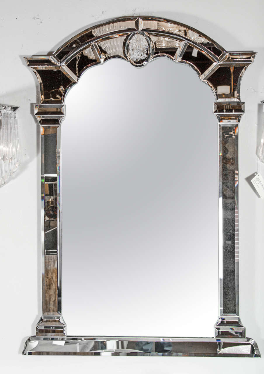 This exceptional pier style Mid-Century mirror features a mirrored border in a two-dimensional style of an arched columnar portico structure creating the illusion of a vista. Each section of the border is hand beveled mirror with a central oval