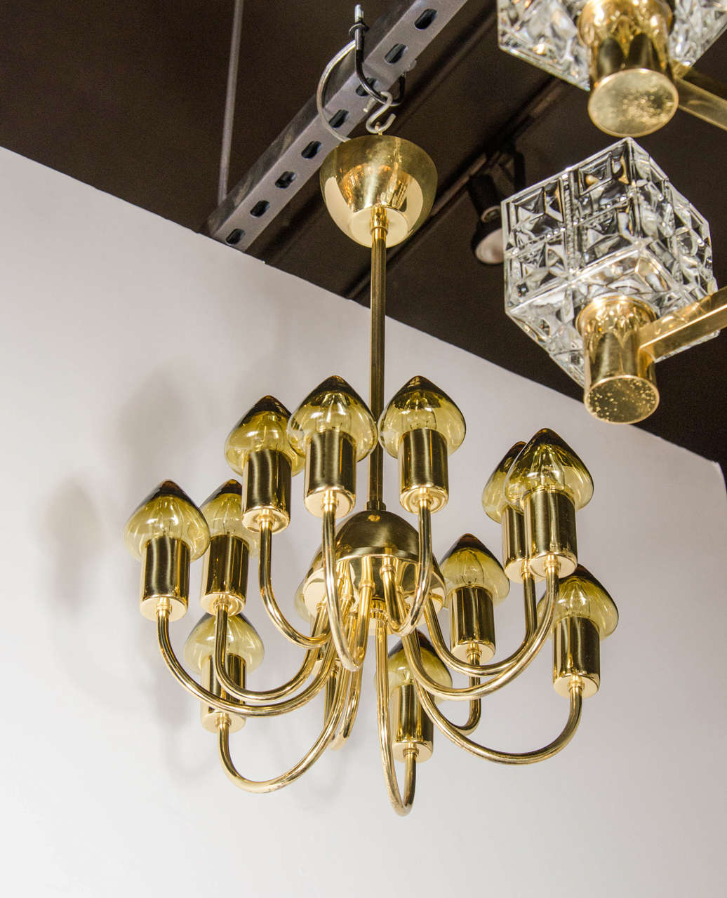 This refined Scandinavian Mid-Century Modern chandelier was realized circa 1960 by the celebrated Swedish designer Hans Agne Jakobsson. Active between 1950 and roughly 1970- often considered the 