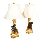 pr of 19th c patinated bronze cherub lamps