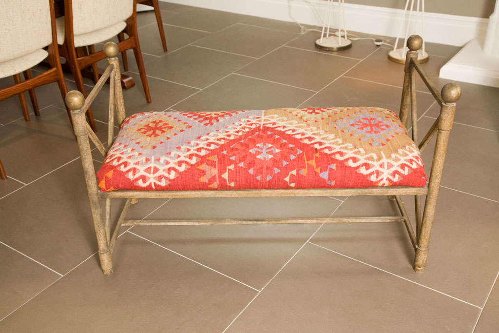 Stylish metal bench, covered in 100 year old kilm rug