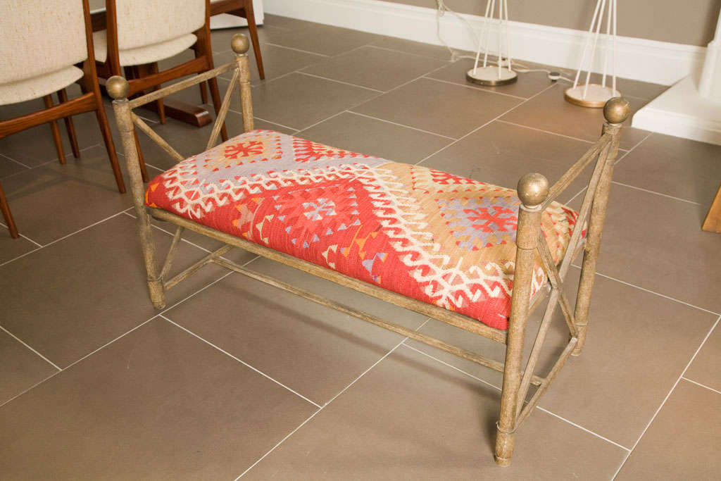 Mid-20th Century Vintage metal bench covered in 100 year old kilm rug