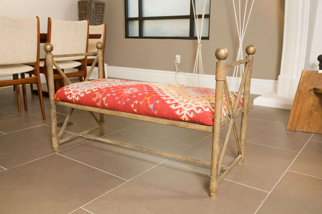 Fabric Vintage metal bench covered in 100 year old kilm rug