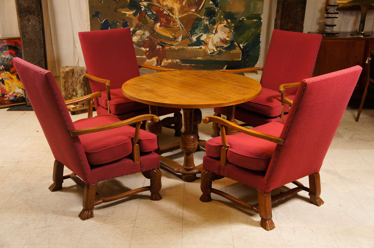 5 piece living room set, four large comfortable upholstered chairs and a round table in the baroque style.   The chairs having paw feet and the table renaissance revival turned legs.   The table measures 
43