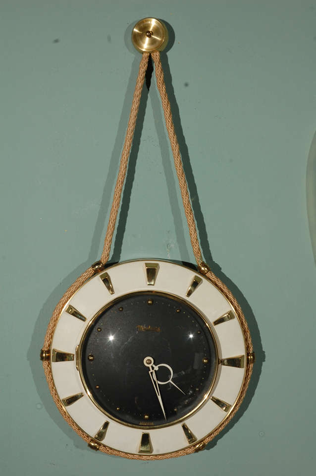 German wall clock with rope with a great aesthetic.