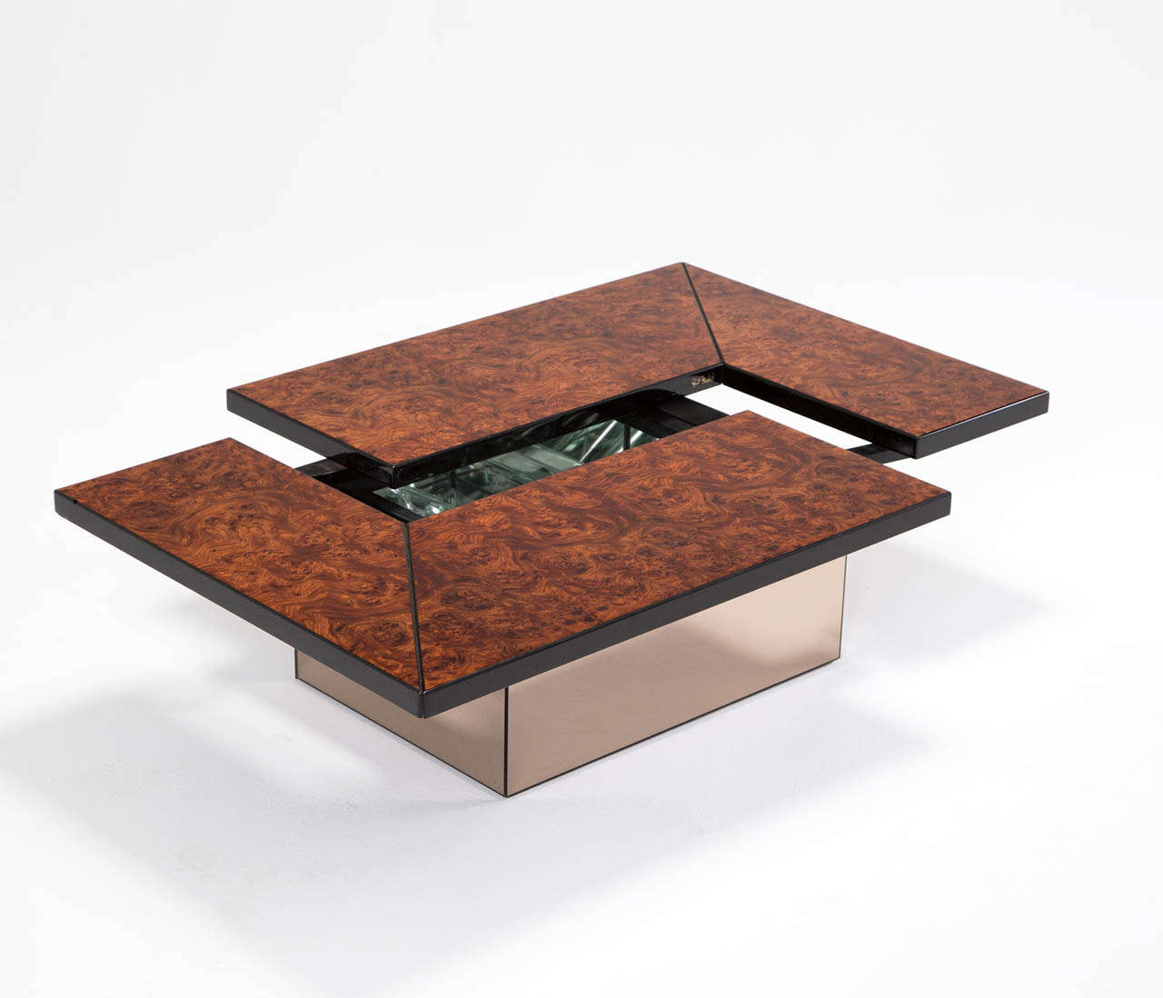 Interesting Willy Rizzo style coffee table with adjustable top which reveals a liquor storage or dry bar hidden inside. The top is veneered with dark walnut burl veneer and smoked mirror base.
Worldwide shipping possibilities: 
For competitive