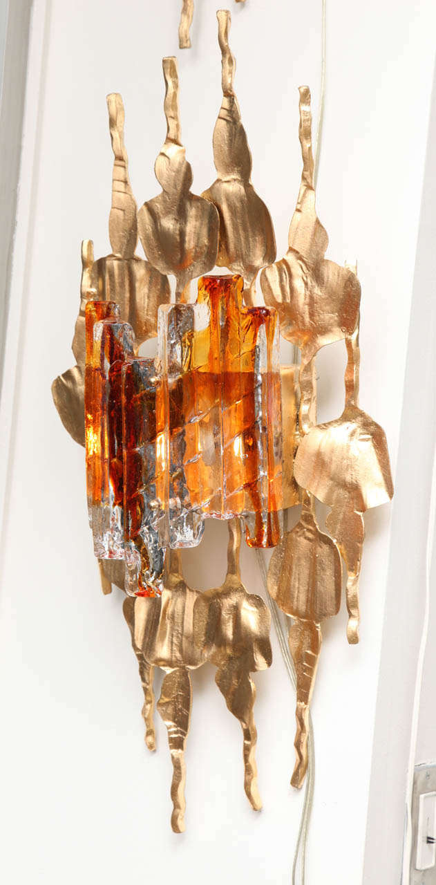 Beautiful pair of large goldleaf metal and glass wall sconces from the late 1960's, by Tom Ahlstrom & Hans Ehrlich, Sweden.