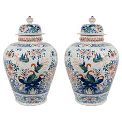 A Pair of Dutch Delft Polychrome Covered Jars