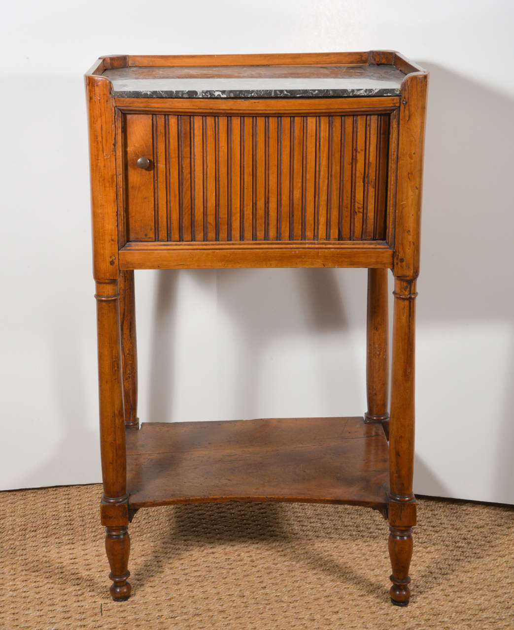 Louis XVI walnut French end table with marble top & folding sliding panel, circa 1799. This fabulous piece is the perfect side table, with its' storage display area and enough room on top for a lamp. It is sure to add warmth and charm to any room in