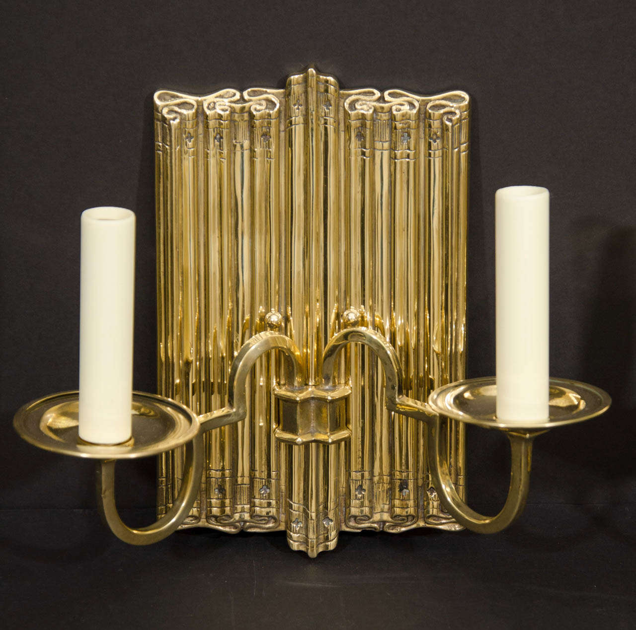 Aesthetic Movement Polished Brass Two Light Linen Fold Backed Sconces For Sale