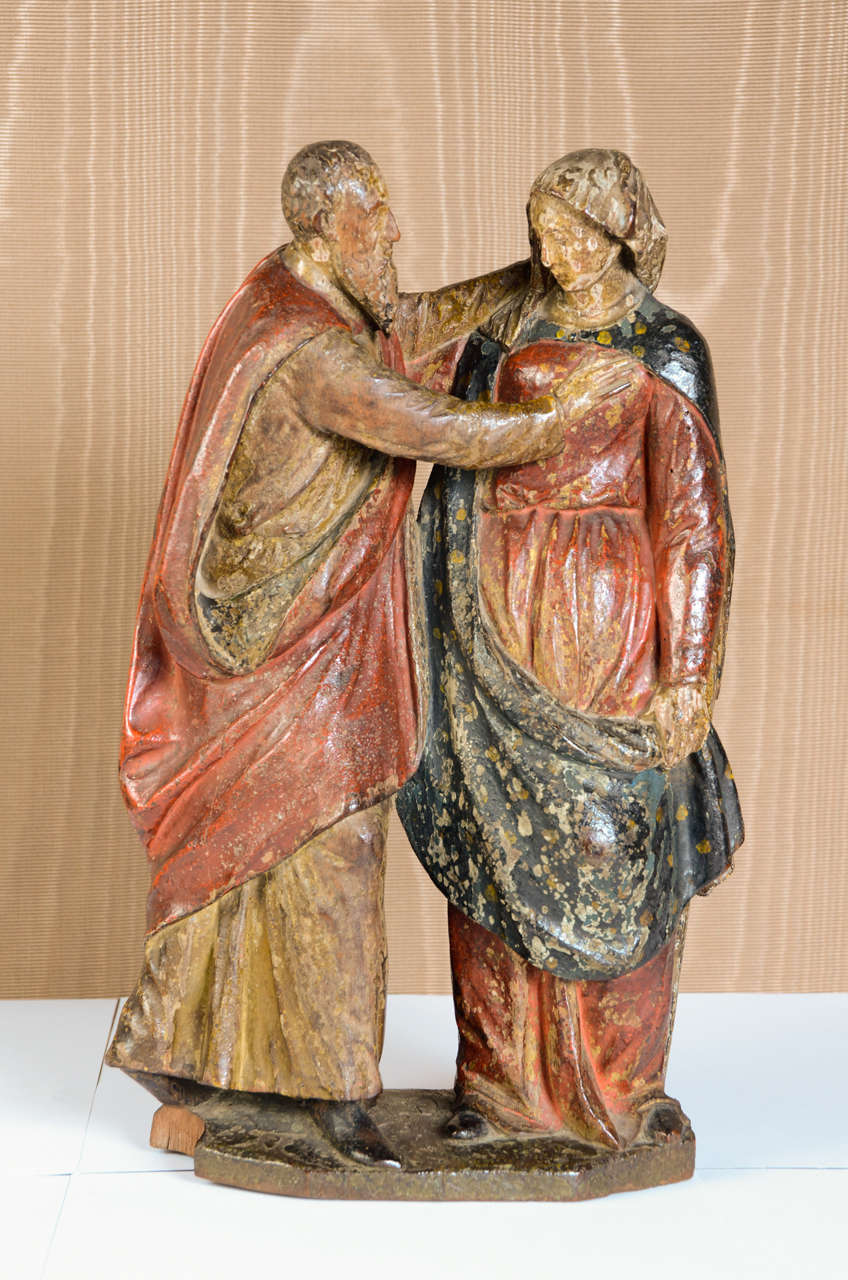 Man gently puts his hand on the breast of the woman in a protective gesture. Original polychrome