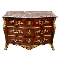 A Regence Ormulu-Mounted and Brass Inlaid Kingwood Commode