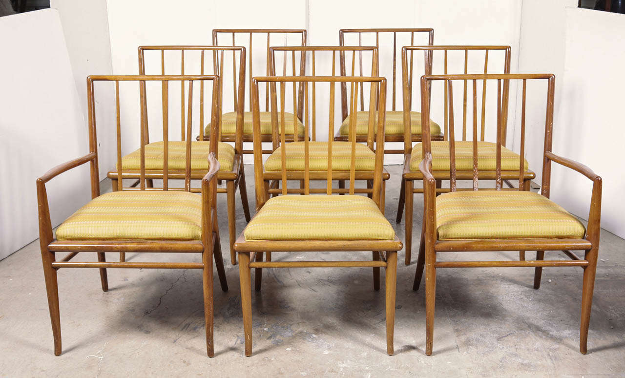 Set of eight walnut spindle back dining chairs by T.H. Robsjohn-Gibbings for Widdicomb, circa 1952.

Consisting of 2 armchairs, and 6 side chairs. 

The chairs are in excellent condition with original upholstery.