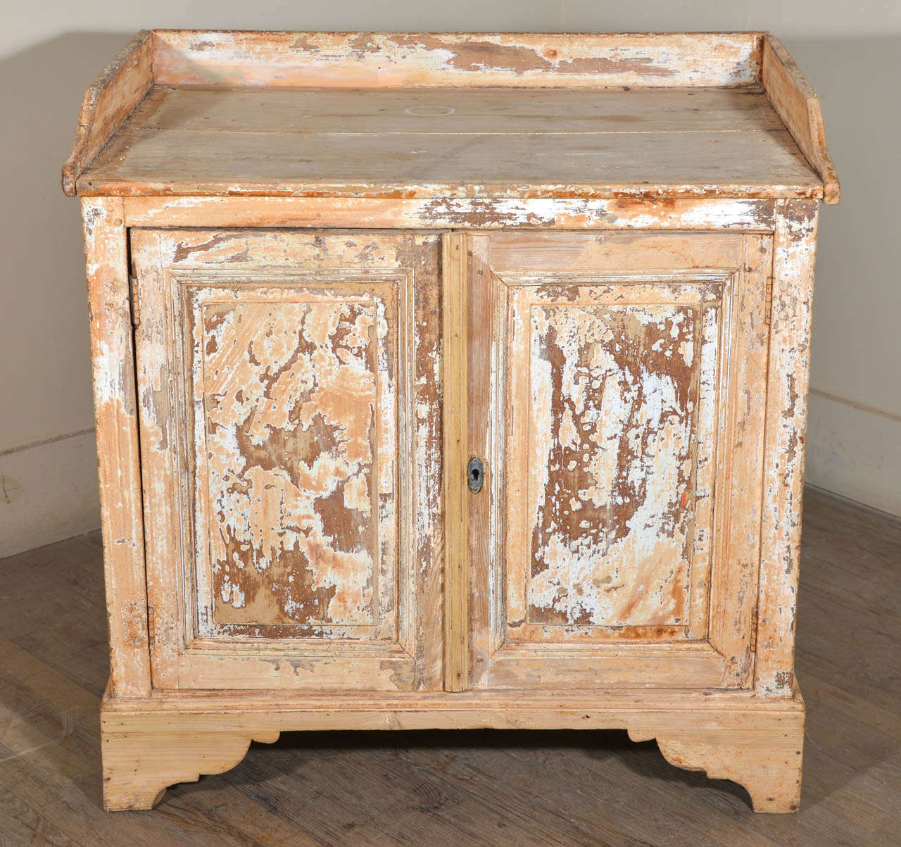 19th century French two door buffet in pine, with remnants of original paint; perfect as a base for a vanity sink.