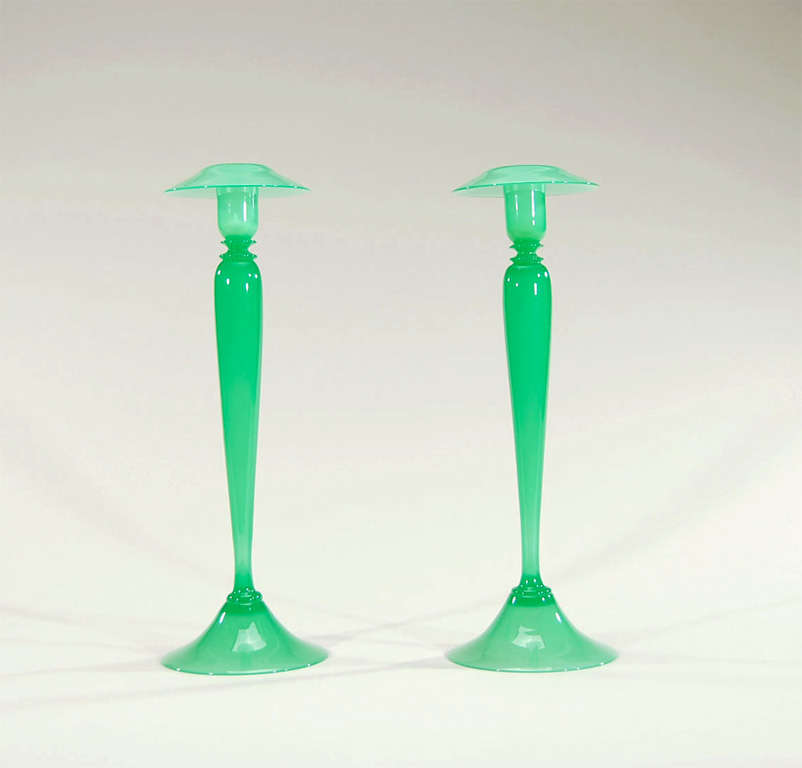 This pair of extraordinary and beautifully matched candlesticks was made by Steuben in the subtle and sought after color of 