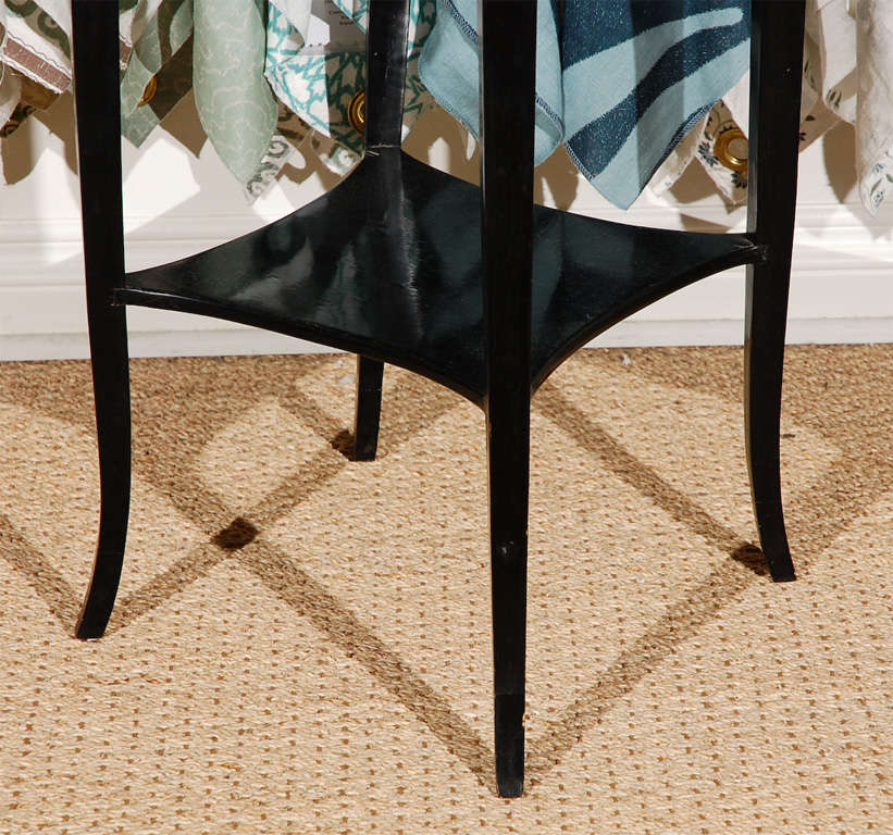 Jansen-style Classical ebonized bedside or end tables with Crotch Mahogany tops and brass rail.