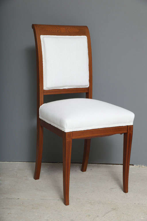 Simple and elegant Empire style chairs with marquetry work.  Upholstered in a white belgian linen.