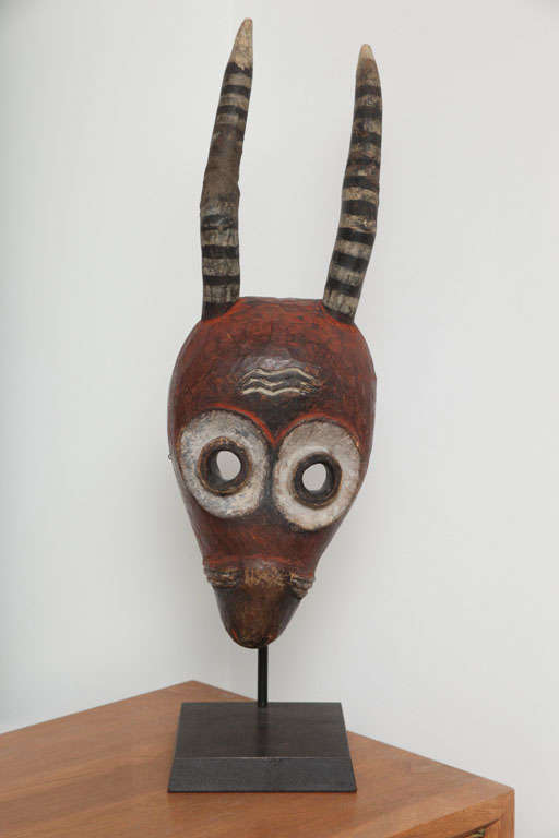 Pende mask circa 1950's.  This horned spirit mask was done in rich pigments and has a wonderful patina to the face and horns.