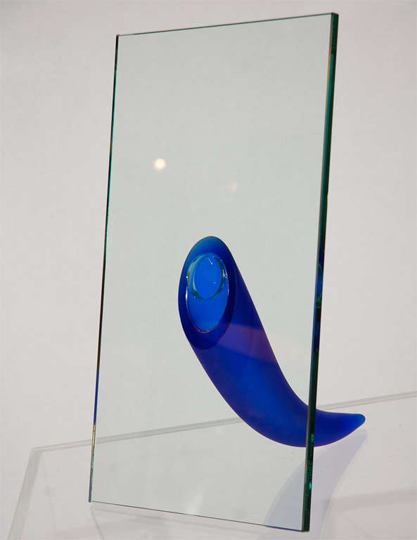Great vase by modern master Philippe Starck, toying with the concept of a picture frame, the sheet of glass is supported by a Cobalt blue horn that holds the flower stems.  This is one of an edition of 50 pieces originally designed for the cutting