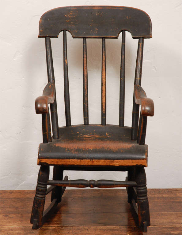 This fantastic original painted  19thc child's rocking chair has the most wonderful old patina. This early child's rocker was found in Maine in a old estate sale.This child's rocker is like a miniature version of the old Boston rocker.This is a
