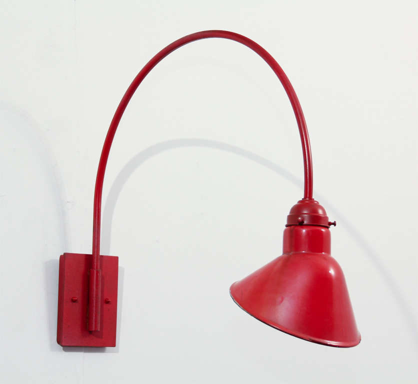 We started with a set thirty of these vintage red-enamel steel reflectors, reclaimed from a factory remodel.   We added our own gooseneck arm and back plate along with socketing.  These would be great for ambient lighting at home or in a casual