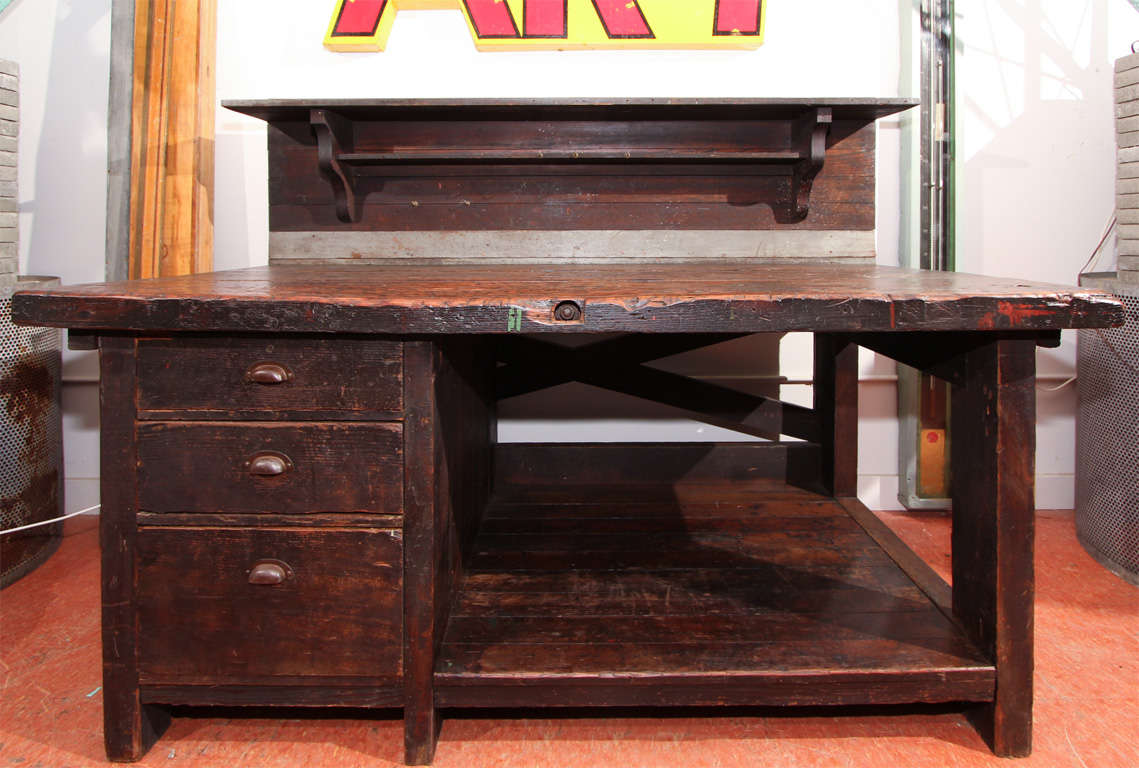 Built like a tank, this foreman's desk is super solid and clean.  This was purchased in  Oregon and is thought to have come from a lumber mill.  The patina is perfection and the second tier is perfect for a flat screen television.   This would also