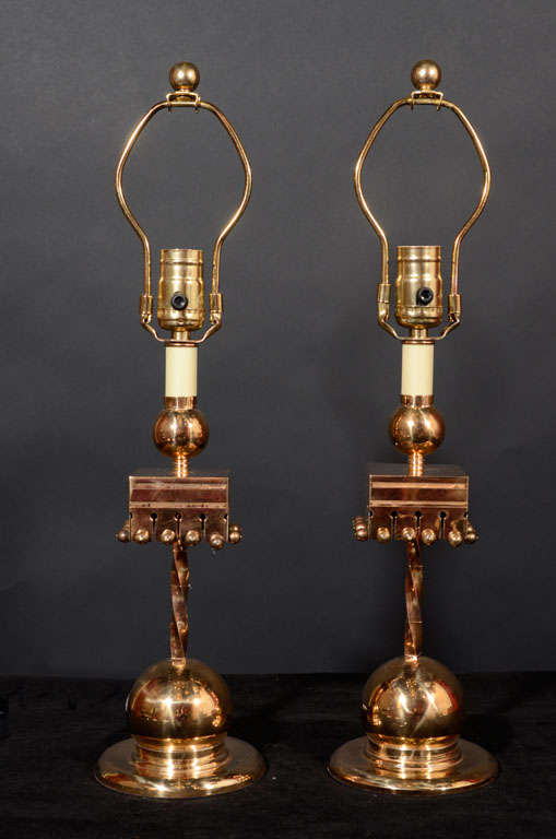 Arts and Crafts brass candlestick lamps.
