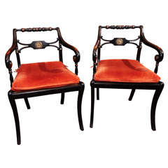 Pair of Black English cane chairs.