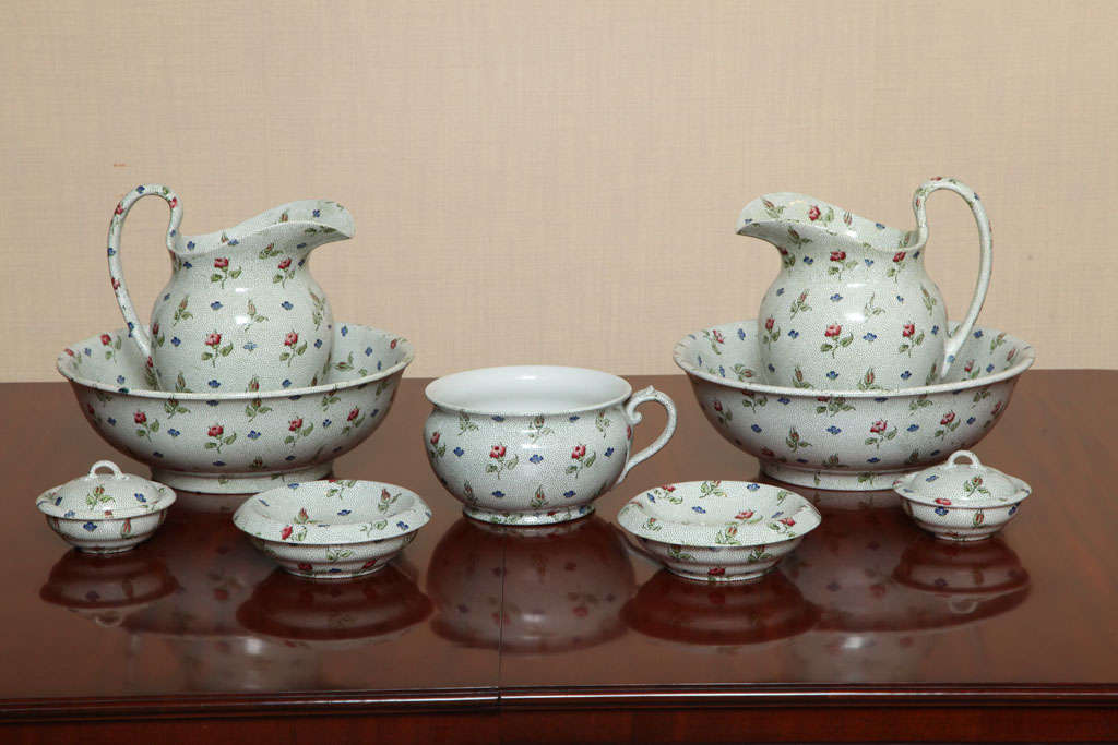Lovely 19th Century Chintz Ware (complete)Bathroom Suite Marked Thomas Goode & Company - Either Spode or Wedgewood. Two Pitchers with Wash Bowls, Two Soap Dishes, Two Sponge Dishes and a Potty.
Circa 1860.