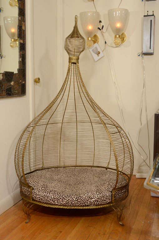 Whimsical gilt brass dog bed with upholstered cushion and tassel detail at top.

View our complete collection at www.johnsalibello.com