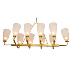 Large linear brass chandelier with twisted bobeches