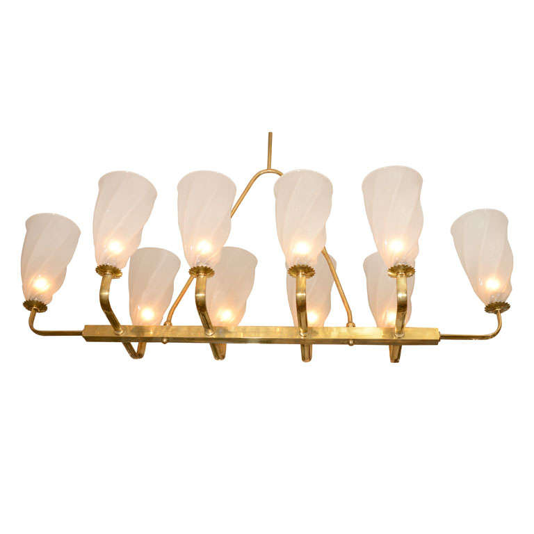 Large linear brass chandelier with twisted bobeches at 1stDibs