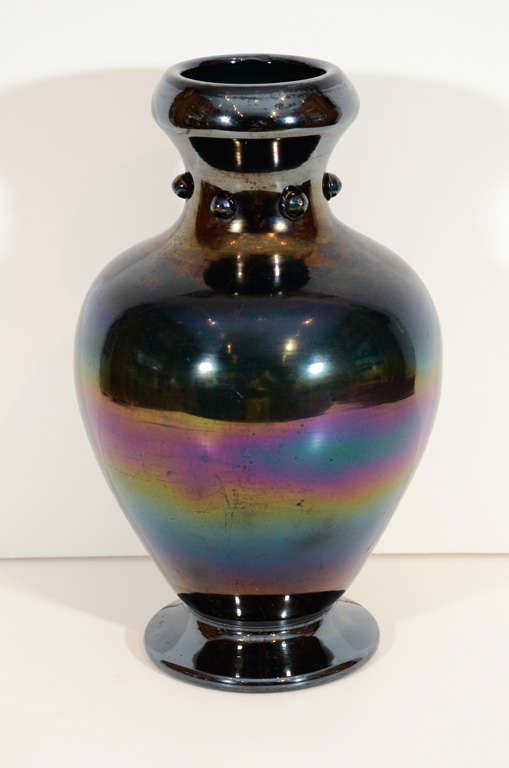 A late 19th century English iridescent bronze glass vase
by Thomas Webb
signed Webb’s Patent J.T. HR
circa 1878

Webb created this style of glass, called Bronze Glass, inspired by ancient Roman glass

With a custom bronze weighted interior