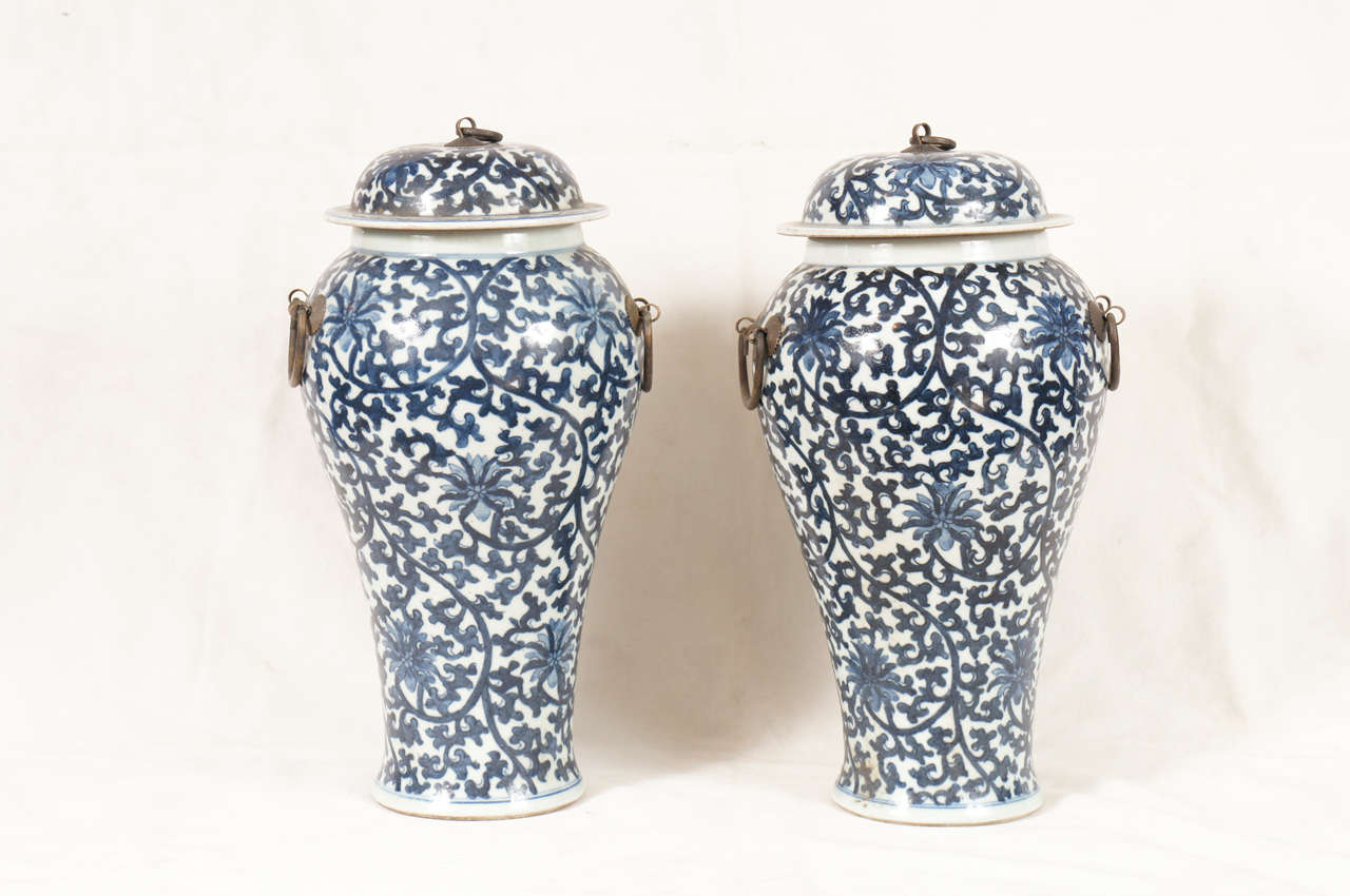 Pair of blue and white ginger jars with lids and gilt metal.