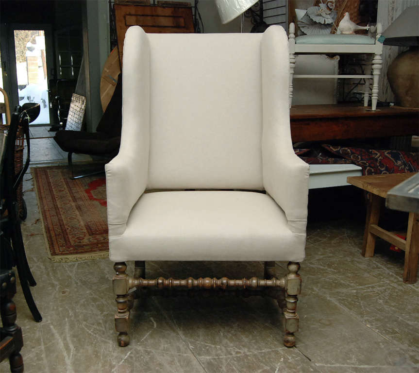 Very handsome Louis XIII Style Wing Chair with slight separation of seat and arm giving it extra sense of style.