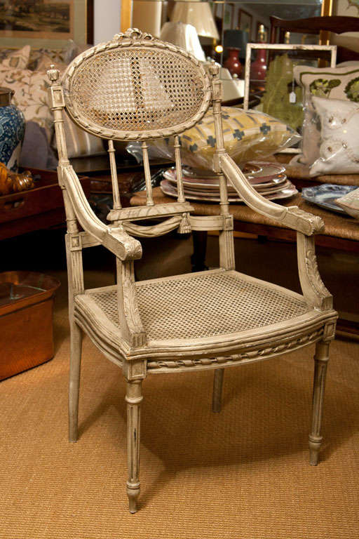 Hand Carved & Painted Armchair.  Caned Back & Seat with Elaborate Details
