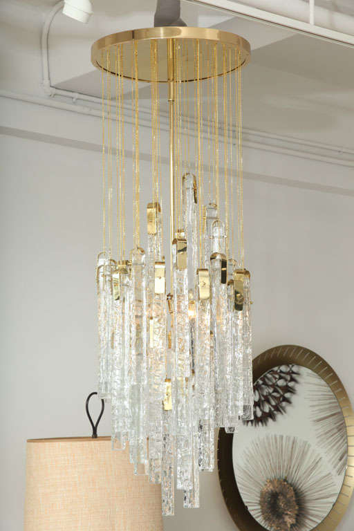 Exceptional pair of Italian brutal glass chandelier. 50 pieces of glass per chandelier. Restored to perfection.