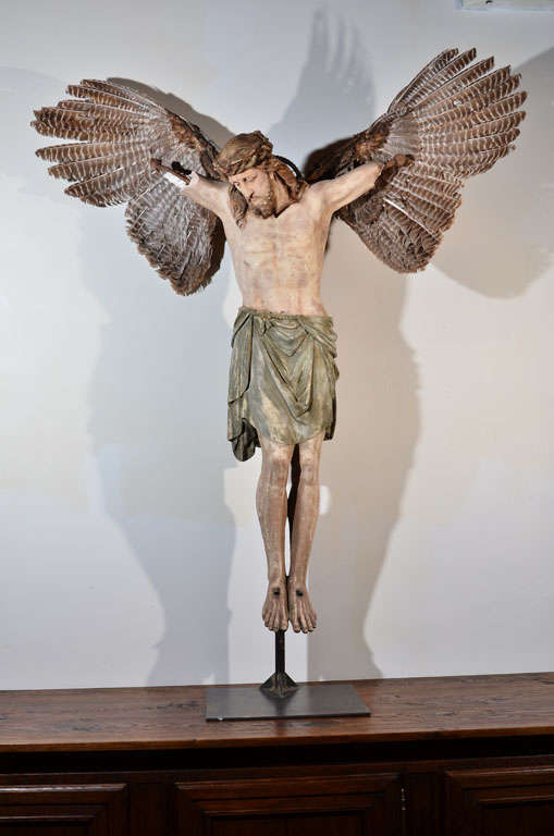 Nineteenth century French Christ, off the cross with attached vintage taxidermy turkey wings and industrial parts.  Figure may be removed from steel base mount.  Modifications made in the Howl Studio.