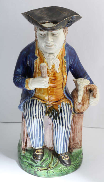 A fine Wood family pottery sailor toby jug decorated in underglaze colors of orange, green. blue and brown