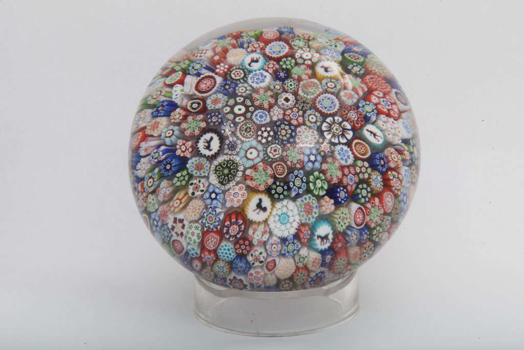 A rare antique Baccarat magnum close-packed millefiori paperweight with Gridel silhouette canes, signed B1848