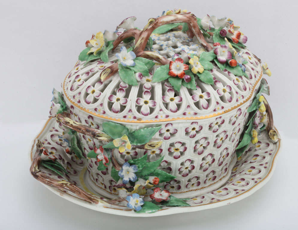 A fine First Period Worcester porcelain covered chestnut basket and stand with applied flowering vine handles