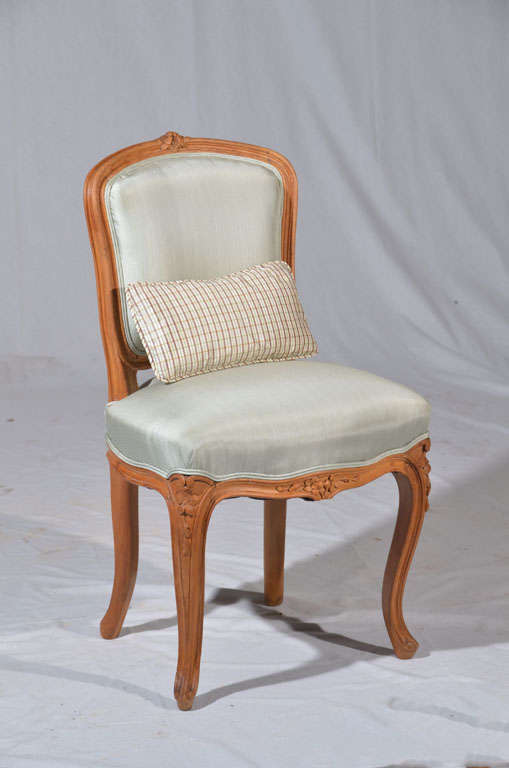 Charming walnut child's chair in the style of Louis XV, early to mid 1800's. Newly upholstered in aqua Brunschwig & Fils silk.