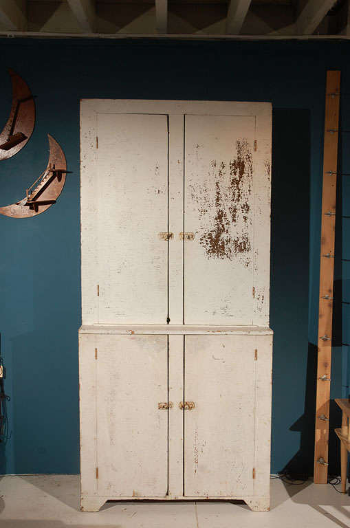 American farmhouse painted hutch with four fixed shelves above and three below.
